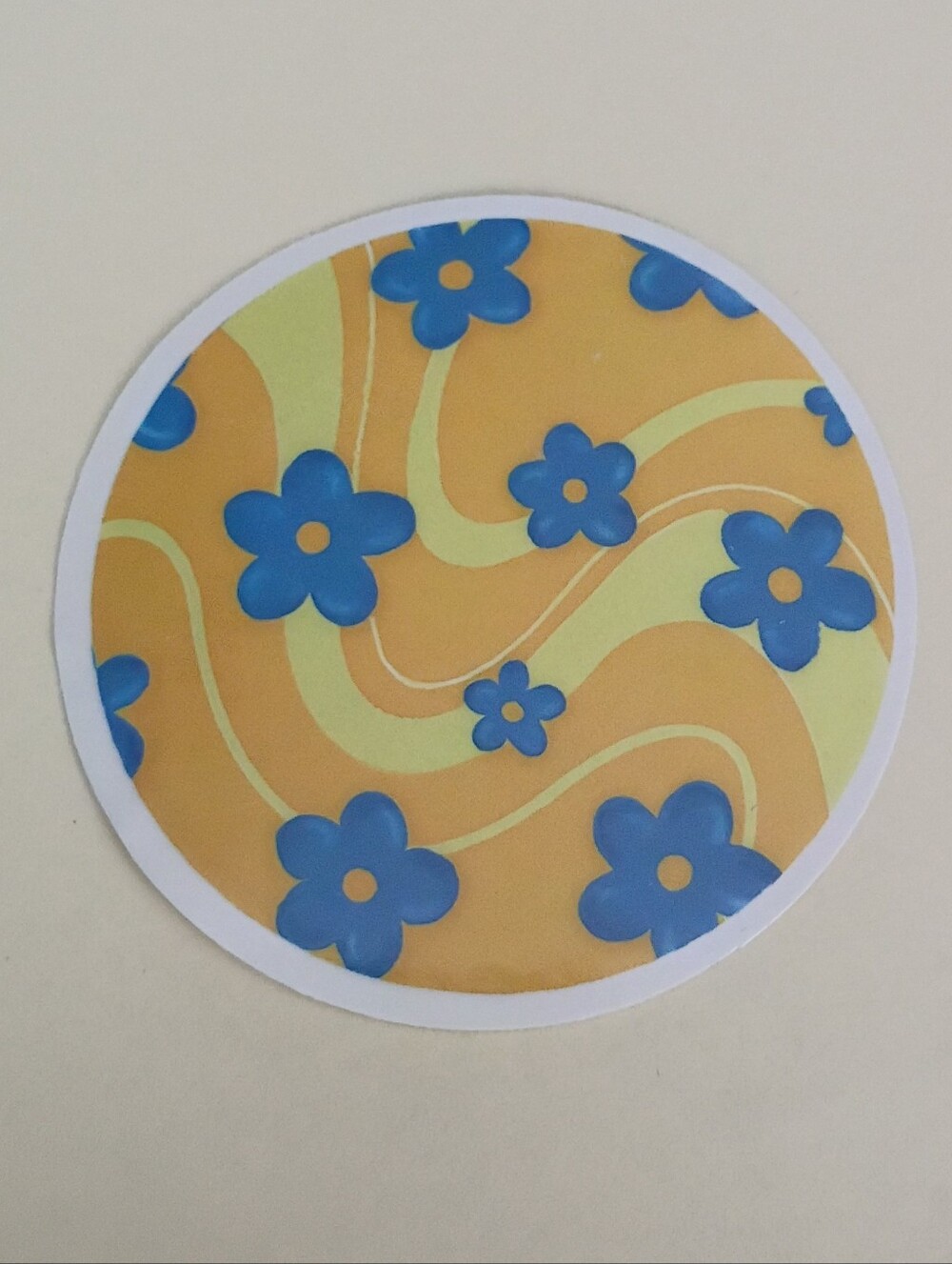 10/$10 Sticker - Blue Daisy Flowers On Yellow Swirlered Circle